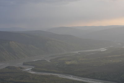 Scenic view of mountains against sky during sunset