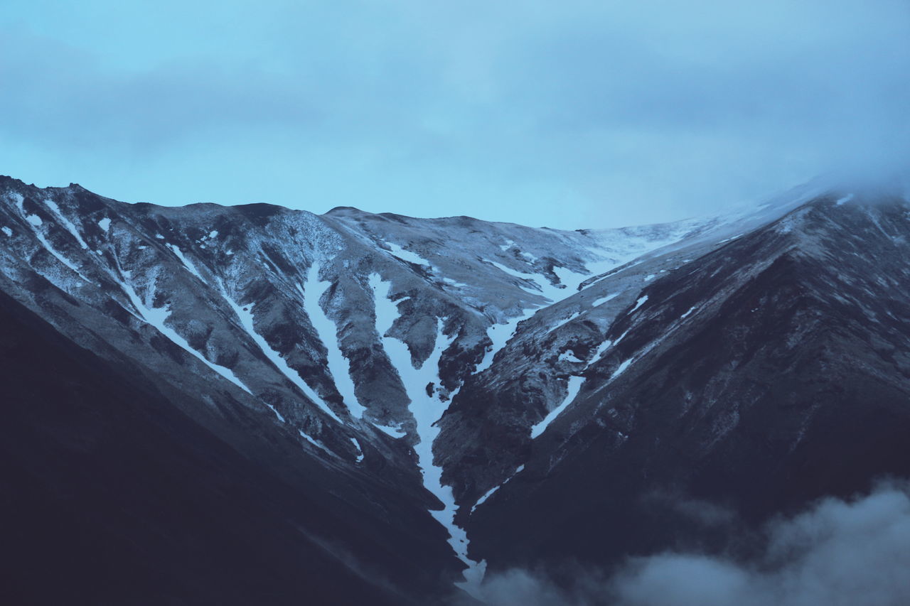 snow, winter, mountain, cold temperature, snowcapped mountain, mountain range, season, scenics, tranquil scene, weather, tranquility, beauty in nature, sky, nature, covering, landscape, majestic, non-urban scene, idyllic, cloud - sky, snowcapped, day, outdoors, no people, blue, remote, physical geography, cloud, cloudy, travel destinations