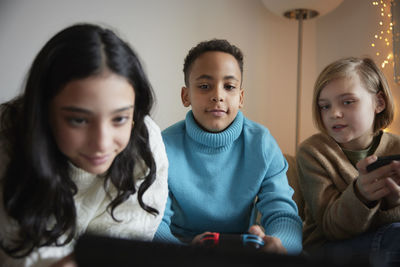 Children playing video games at home