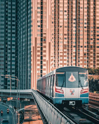 Train against buildings in city
