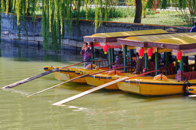 People on boat in river