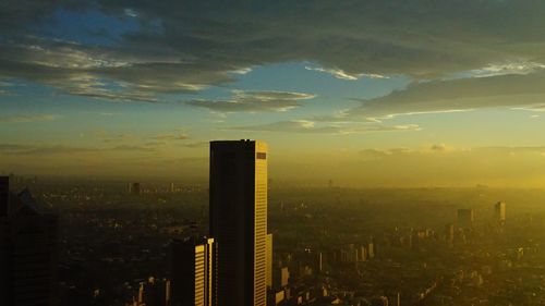 View of skyscrapers at sunset