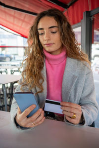 Young woman using mobile phone