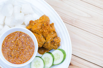 High angle view of serving food in plate on table