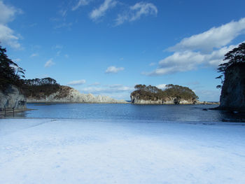 Scenic view of sea against blue sky