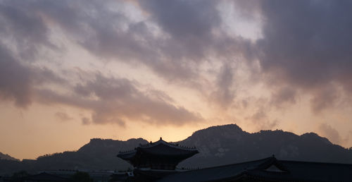 Panoramic view of mountains against sky during sunset