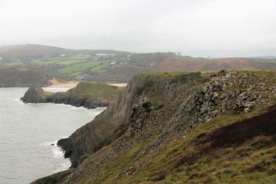 Aerial view of landscape and sea against sky