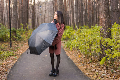 Full length of woman in forest