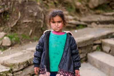 Portrait of girl standing outdoors