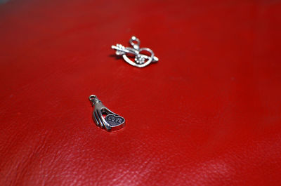 Close-up of pendants on red table