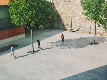 Woman standing on footpath