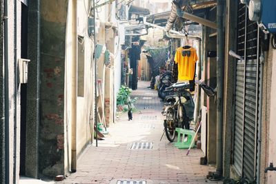 People on street amidst buildings in city