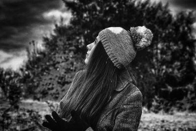 Young woman with long hair wearing knit hat