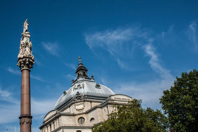 Low angle view of bell tower against sky