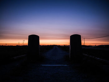 Silhouette landscape against sky during sunset