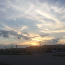 Scenic view of landscape against cloudy sky