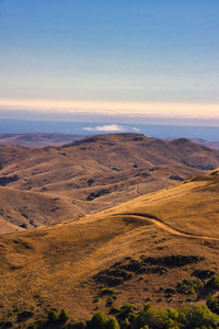 Scenic view of landscape against sky during sunset