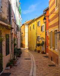 An alleyway with colorful houses in the picturesque resort town of cassis in southern france