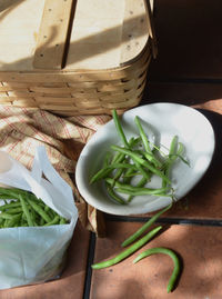 High angle view of vegetables in basket on table