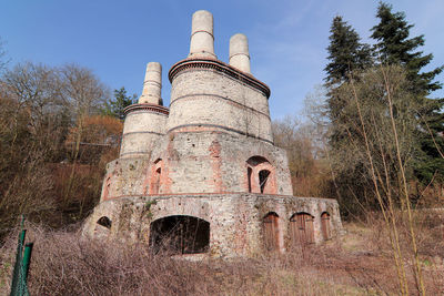 Old abandoned building against clear sky