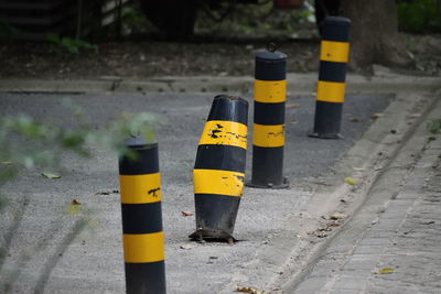 Striped bollards on footpath