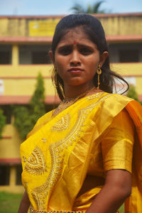Portrait of beautiful woman standing outdoors