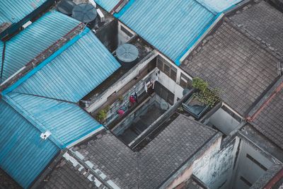 High angle view of houses by swimming pool in city