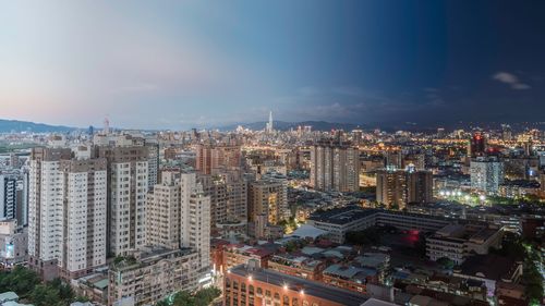 Aerial view of cityscape against sky