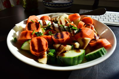 Close-up of fruits in plate on table