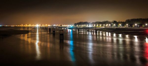 Reflection of illuminated buildings in water