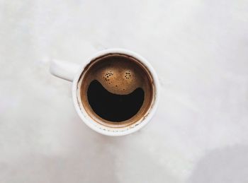 High angle view of coffee cup on table