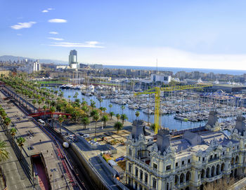 High angle view of street amidst buildings against sky