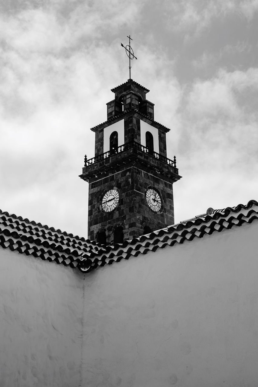 LOW ANGLE VIEW OF CLOCK TOWER BY BUILDING AGAINST SKY
