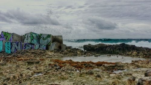 Scenic view of sea against cloudy sky