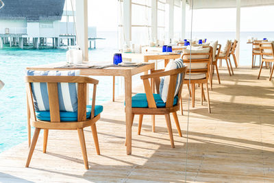 Empty chairs and table in restaurant