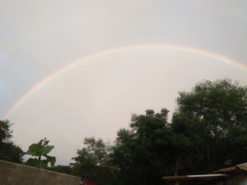 Low angle view of rainbow against sky