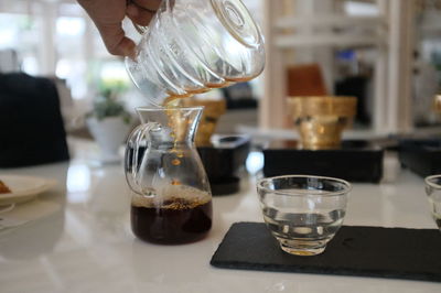 Glass of coffee cup on table