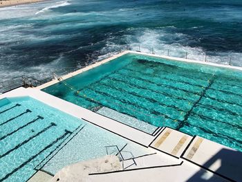 High angle view of swimming pool by sea