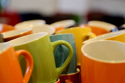 Close-up of multi colored coffee cup
