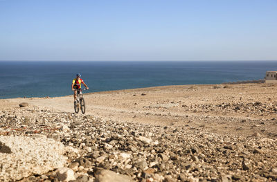 Spain, canary islands, fuerteventura, senior man on mountainbike