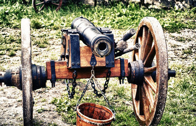 Close-up of cannon cart on field