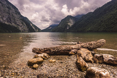 Scenic view of lake and mountains against sky