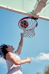 Low angle view of basketball hoop against sky