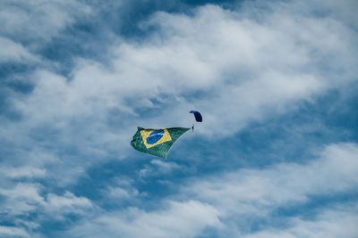 Low angle view of kite flying against sky