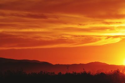 Scenic view of dramatic sky during sunset