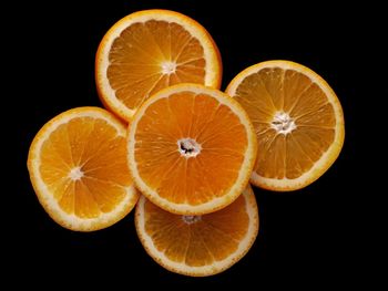 Close-up of oranges against black background