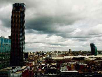 Modern buildings in city against sky