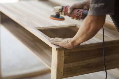 Low section of man working in workshop