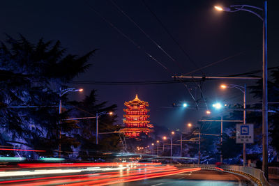 Light trails on city street at night