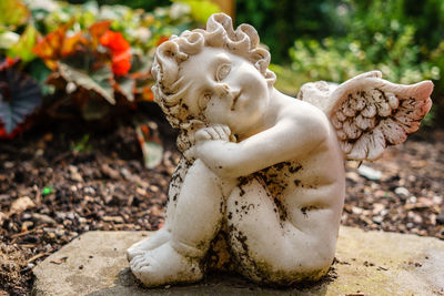 Close-up of statue against white wall